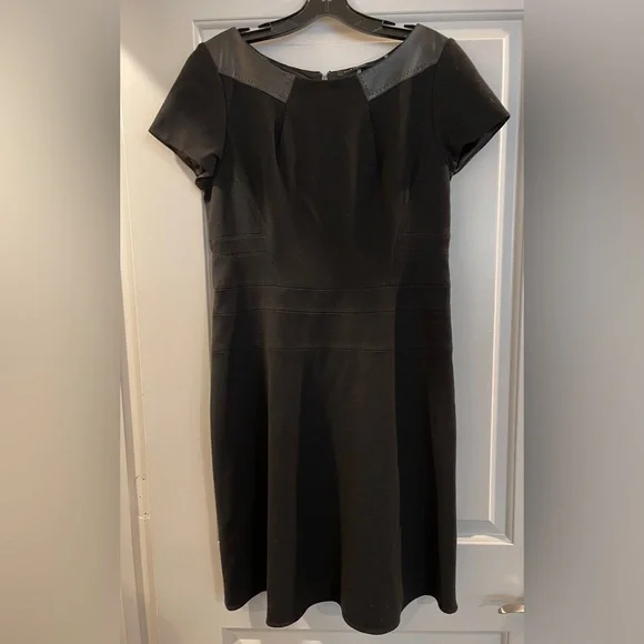 Elie Tahari Joan Black Short Sleeve Dress with Leather like Details. Size 12 NWT Elie Tahari Joan Black Short Sleeve Dress with Leather like Details. Size 12 NWT